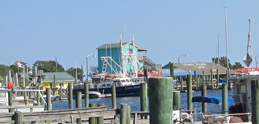 shops dining and boats at the Old Yacht Basin area in Southport NC